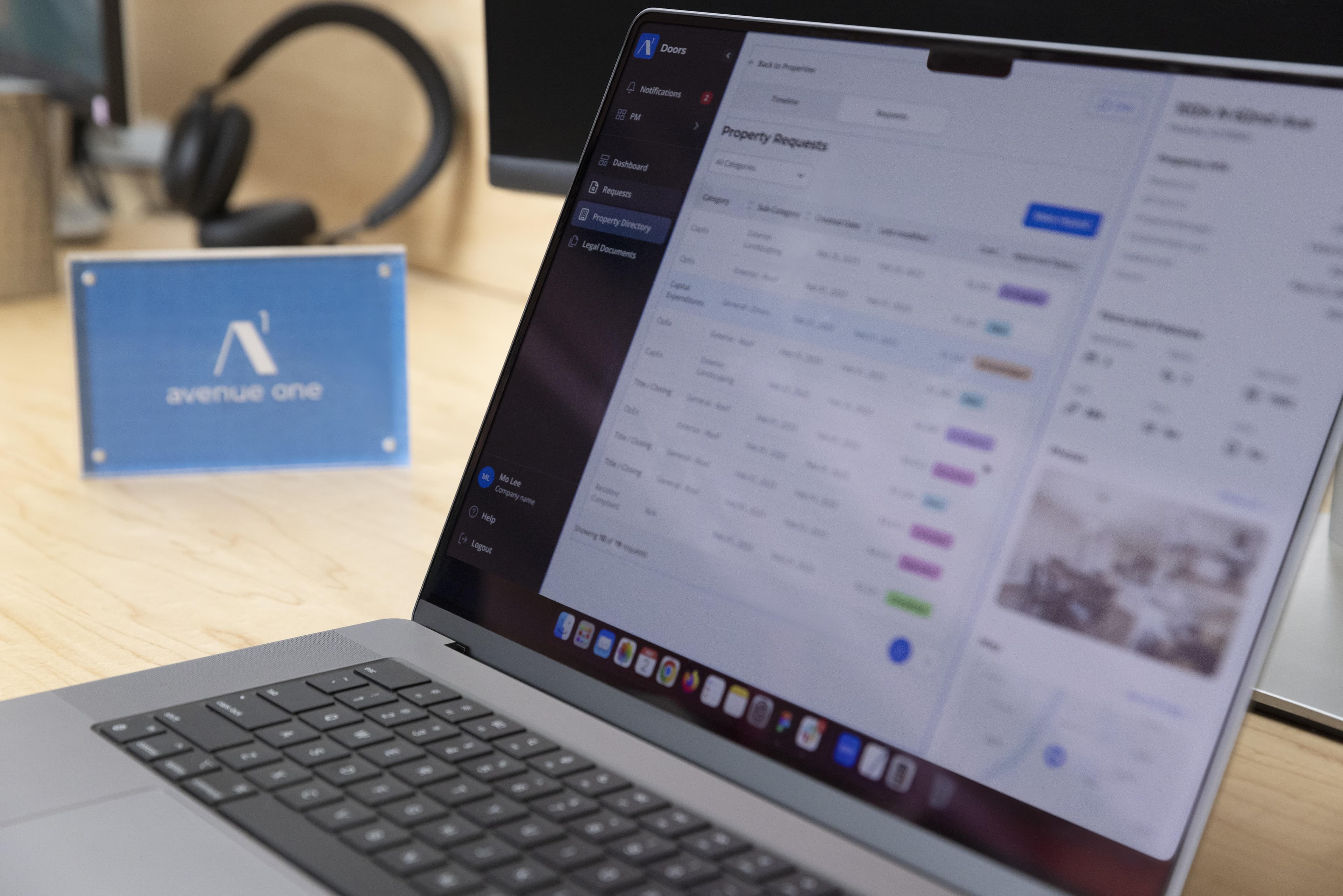 Photo of the side of a laptop with an avenue one platform on screen