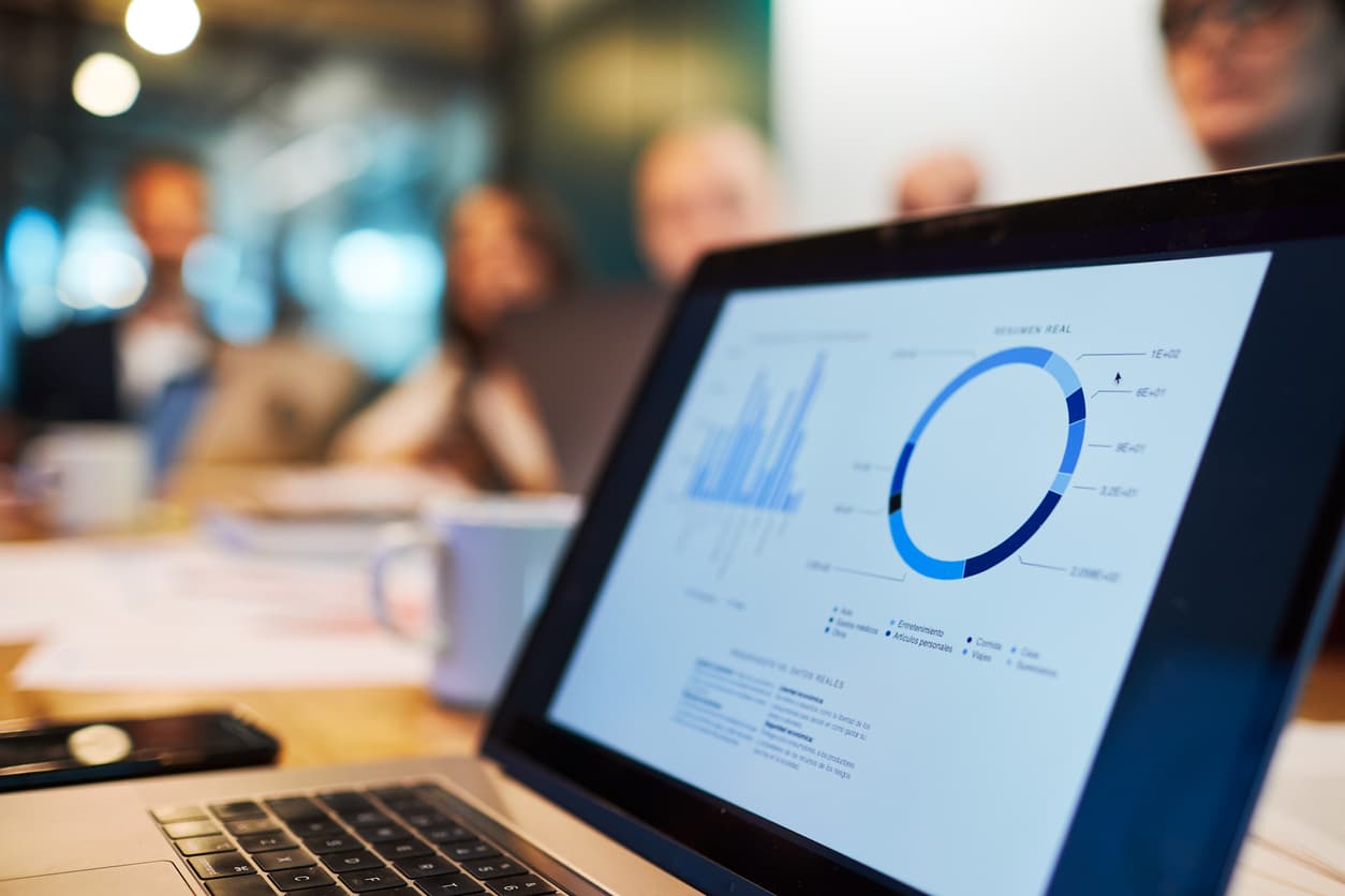 Photo of laptop with graphs on the screen